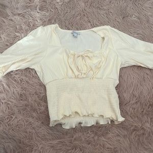 Cream blouse, size medium, never been worn before stretchy, soft material